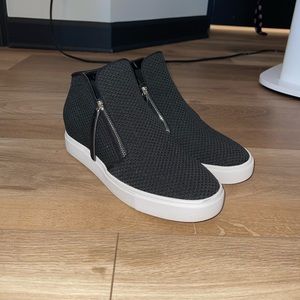 casual zip up shoes with a little heal to them